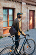 © BONNINSTUDIO/Stocksy - Man with bicycle on street