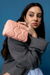 © Tania Cervian/Stocksy - Young woman with money purse in room