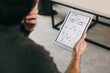 © VICTOR TORRES/Stocksy - Analyzing Bitcoin Investment on a Tablet