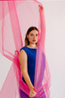 © Tania Cervian/Stocksy - Ballerina in blue outfit grabbing fabric while looking at camera