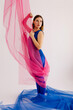 © Tania Cervian/Stocksy - Dancer in bodysuit and tights standing with fabric wrapped round body