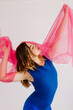© Tania Cervian/Stocksy - Dreamy female model in casual outfit stretching body