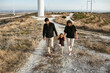 © Irina Polonina/Stocksy - Family Walk Near Wind Turbines