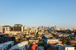 © Shava Cueva/Stocksy - View of the city of Melbourne Australia with a blue sky