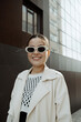 © Azamat Mukanov/Stocksy - Smiling Asian Woman in Sunglasses