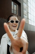 © Azamat Mukanov/Stocksy - Smiling Asian Woman in Sunglasses