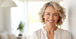 © rohappy - Portrait of beautiful happy smiling mature woman looking at camera standing in white room at home