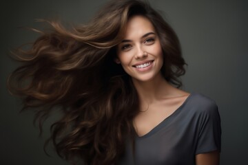 Wall Mural - portrait of a young beautiful woman with long curly hair, close-up face, on a dark background, studio beauty photo, style and fashion