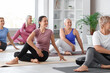 © Pixel-Shot - Group of sporty mature women practicing yoga in gym