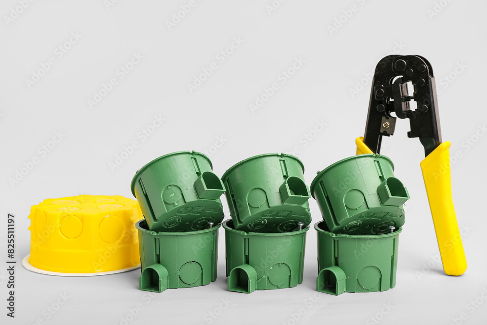 Set of electrician's tools on light background