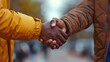 © KHF - A firm handshake between two adult men of different ethnicities outdoors, symbolizing agreement and partnership.