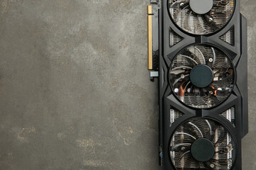 Poster - One graphics card on grey table, top view. Space for text