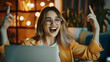 © Daniel - Joyful business woman freelancer entrepreneur smiling and rejoices in victory while sitting at desk