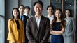 © chutikan - Young Asian businessmen standing together