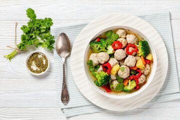 Wall Mural - chicken meatball soup with vegetables in a bowl