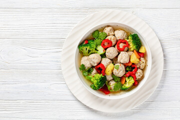 Poster - chicken meatball soup with vegetables in a bowl