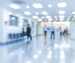 © kkkiim graphic - Blurred background of a medical clinic with figures in white and blue, focused on a doctor's office with medical equipment and out of focus people in hospital corridors, ideal for creating clean, prof