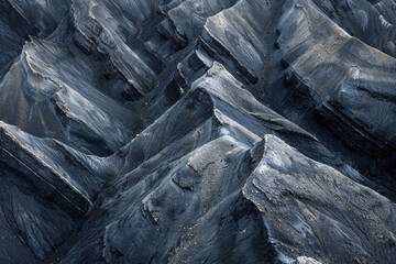 Wall Mural - Minimalist aerial view of mountain ridges, showcasing sharp lines and natural patterns in the terrain. 