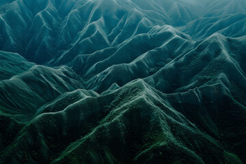 Canvas Print - Minimalist aerial view of mountain ridges, showcasing sharp lines and natural patterns in the terrain. 