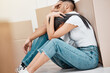 © peopleimages.com - Couple, home and moving boxes or tired stress for new house or packing burnout, anxiety or frustrated. Man, woman and real estate investment or apartment eviction with mortgage, pressure or challenge
