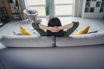 Canvas Print - Rear photo of pretty young lady sit couch arms behind head wear green shirt weekend modern apartment indoors