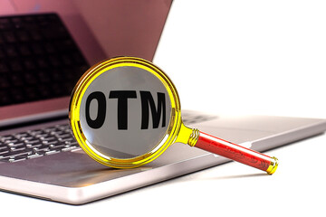 Poster - OTM word on magnifier on laptop , white background