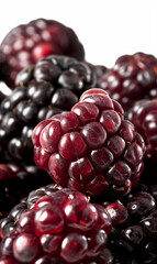 Wall Mural - Closeup of boysenberries texture with glossy red and black surface