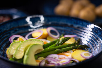 Wall Mural - Potato salad with avocado, green asparagus and eggs