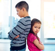 © peopleimages.com - Argue, fight or sibling rivalry with brother and sister in home for anger, competition or conflict. Back of children, family or frustration with young boy and girl in apartment for disagreement