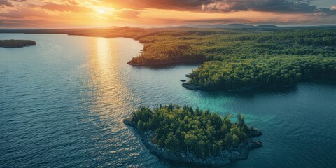Aerial view of Lake coastline with forest along the coast at sunset