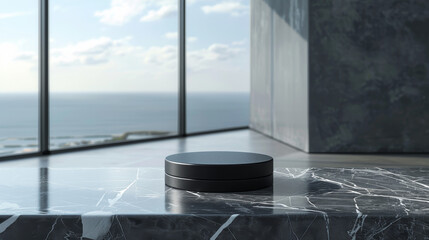 A small black device sits on a marble countertop in front of a large window