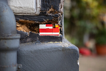 Collapsed wall - wall repaired with building blocks - funny idea - creative work