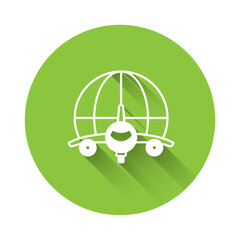 Sticker - White Globe with flying plane icon isolated with long shadow background. Airplane fly around the planet earth. Aircraft world icon. Green circle button. Vector