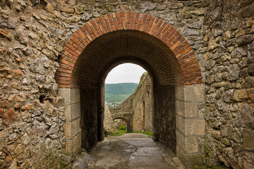 Wall Mural - ancient Trencin Castle in Slovakia 11th century. A wall with an archway.