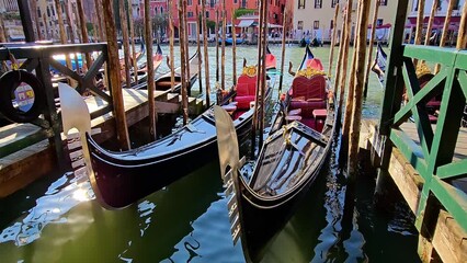 Wall Mural - Luxurious gondolas on the quay on Grand Canal on a sunny day