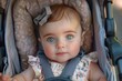 © Lens Legacy - An infant girl with expressive blue eyes and a bow looks curiously at the camera while seated in a stroller