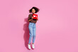© deagreez - Full length photo of lovely young lady jump hold heart icon dressed stylish brown garment isolated on pink color background