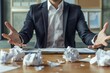 © Deivison - Business professional with open hands showing crumpled papers on the table.