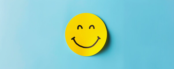 Yellow Paper Cut Smile Face for Positive Thinking and Mental Health Assessment on Minimalist Pale Blue Background