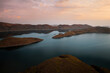 © AmazingAerialAgency - Aerial view of mountain peak at sunset, Lake Argyle, Western Australia.