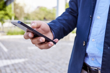 Aufkleber - Business hands, phone and typing in city for communication, chat and search location or travel news. Worker reading on mobile for contact, information or transport services in parking lot or outdoor