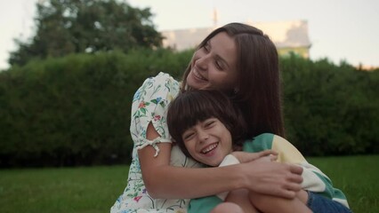 Poster - Happy mother and her son having fun in park