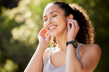 Canvas Print - Fitness, calm and woman in park with music for sports, exercise or audio for motivation. Outdoor, female runner and headset for workout while listening radio, podcast and healthy to run in nature