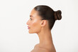 © Home-stock - Beauty profile of young European woman with healthy skin natural makeup and perfect nose, lady posing isolated on white background, side view