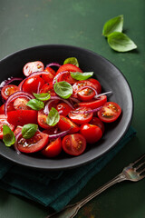 Wall Mural - healthy tomato salad with onion basil olive oil and balsamic vinegar