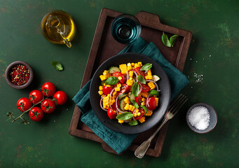 Wall Mural - healthy vegetarian tomato sweet corn salad with cucumber and basil