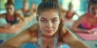 © LoL - Group of young sporty people practicing yoga lesson, working out, indoor close up, students training in club, studio