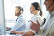 © peopleimages.com - Call center, woman and smile with headphone, conversation and communication in workplace. Group, technology and telemarketing agent or team in office for consulting, customer service and support
