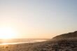 © Austockphoto - Sunset over beach with large sky