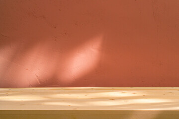 Sticker - Table with coral pink wall and sunlight reflections. Food, product or cosmetic background.	
